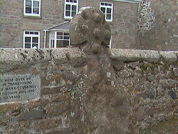 An old cross set into the church wall