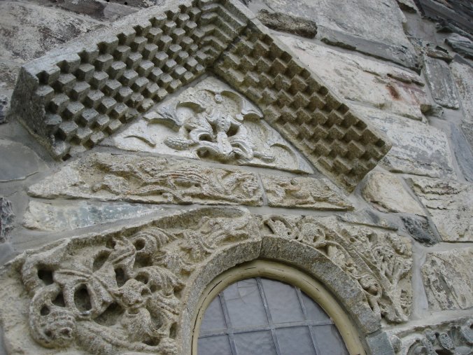 Other fragments of Romanesque sculpture set into the current church wall.